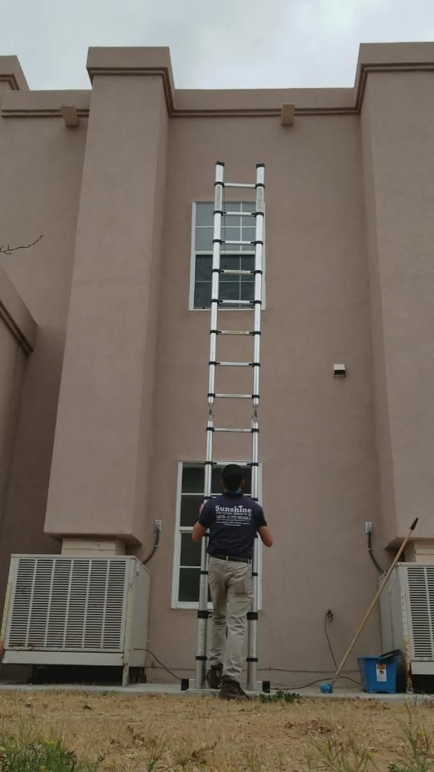 An employee at Sunshine Window Cleaning